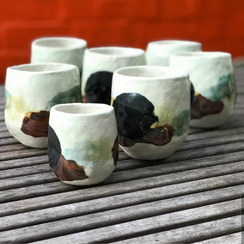 set of handmade clau drinking cups with spot colour