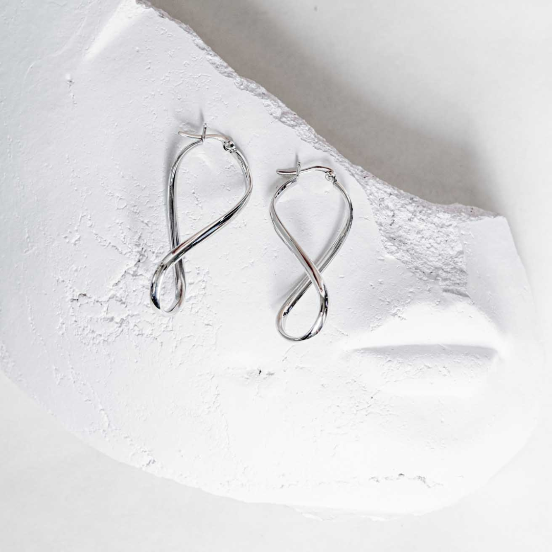 INFINITY SILVER HOOP EARRINGS - Connie Dimas